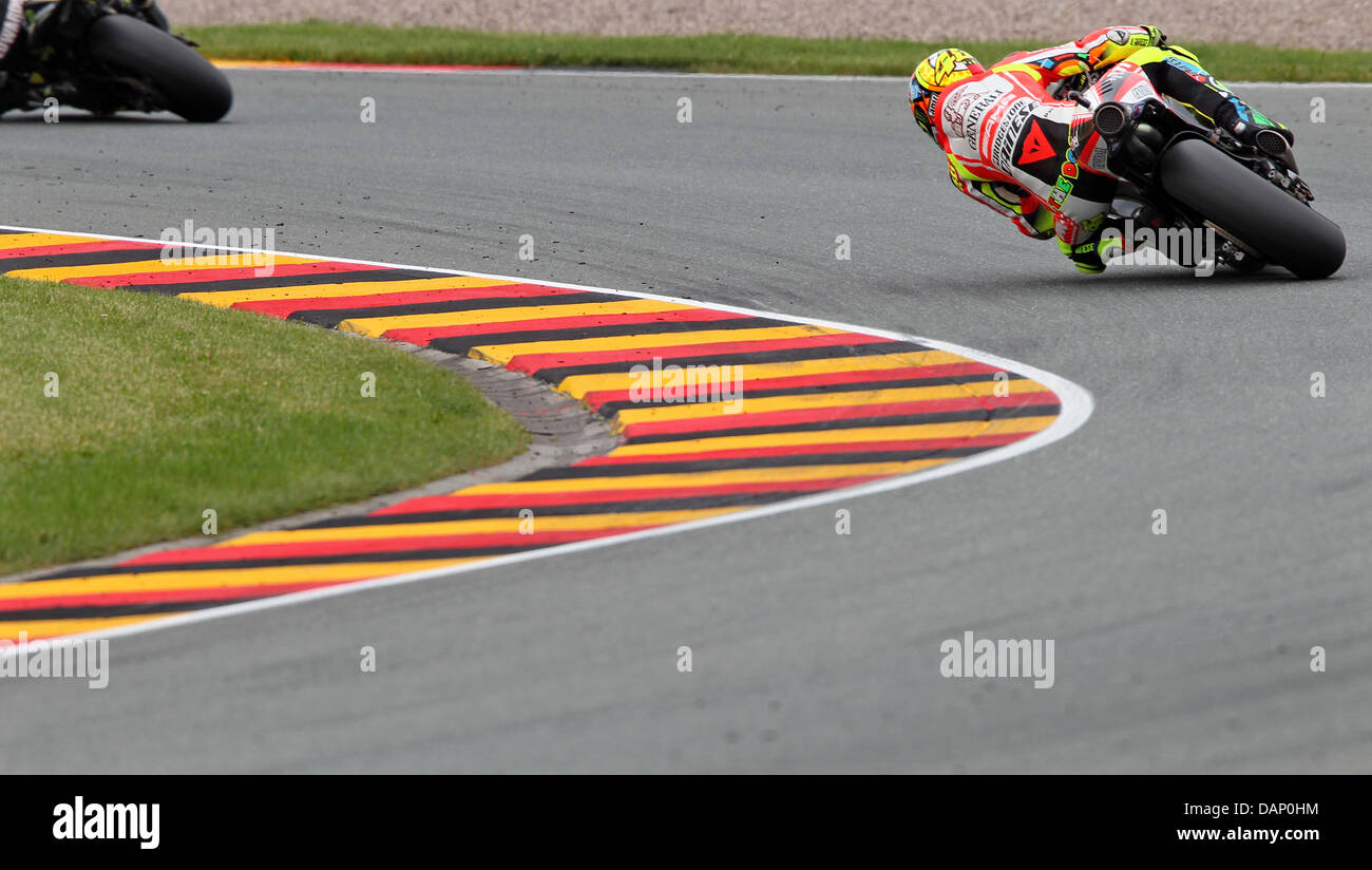 Italian Ducati pilot Valentino Rossi rides his motorcycle in the MotoGP race of the Germany Grand Prix at the Sachsenring near Hohenstein-Ernstthal, Germany, 17 July 2011. Photo: Jan Woitas Stock Photo