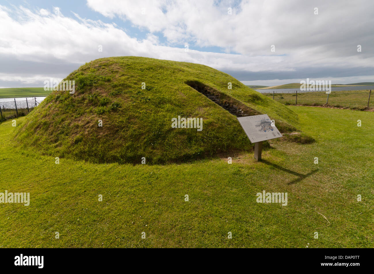 The chambered tomb of Unstan on Orkney Mainland with the Loch of Stenness in the background. Stock Photo