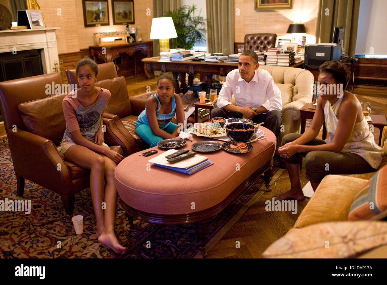 HANDOUT - The White House handout picture, dated 17 July 2011, shows President Barack Obama and his daughters Sasha and Malia, watching the World Cup soccer match between the U.S. and Japan, from the Treaty Room office in the residence of the White House, Washington, USA. (Official White House Photo by Pete Souza) Stock Photo