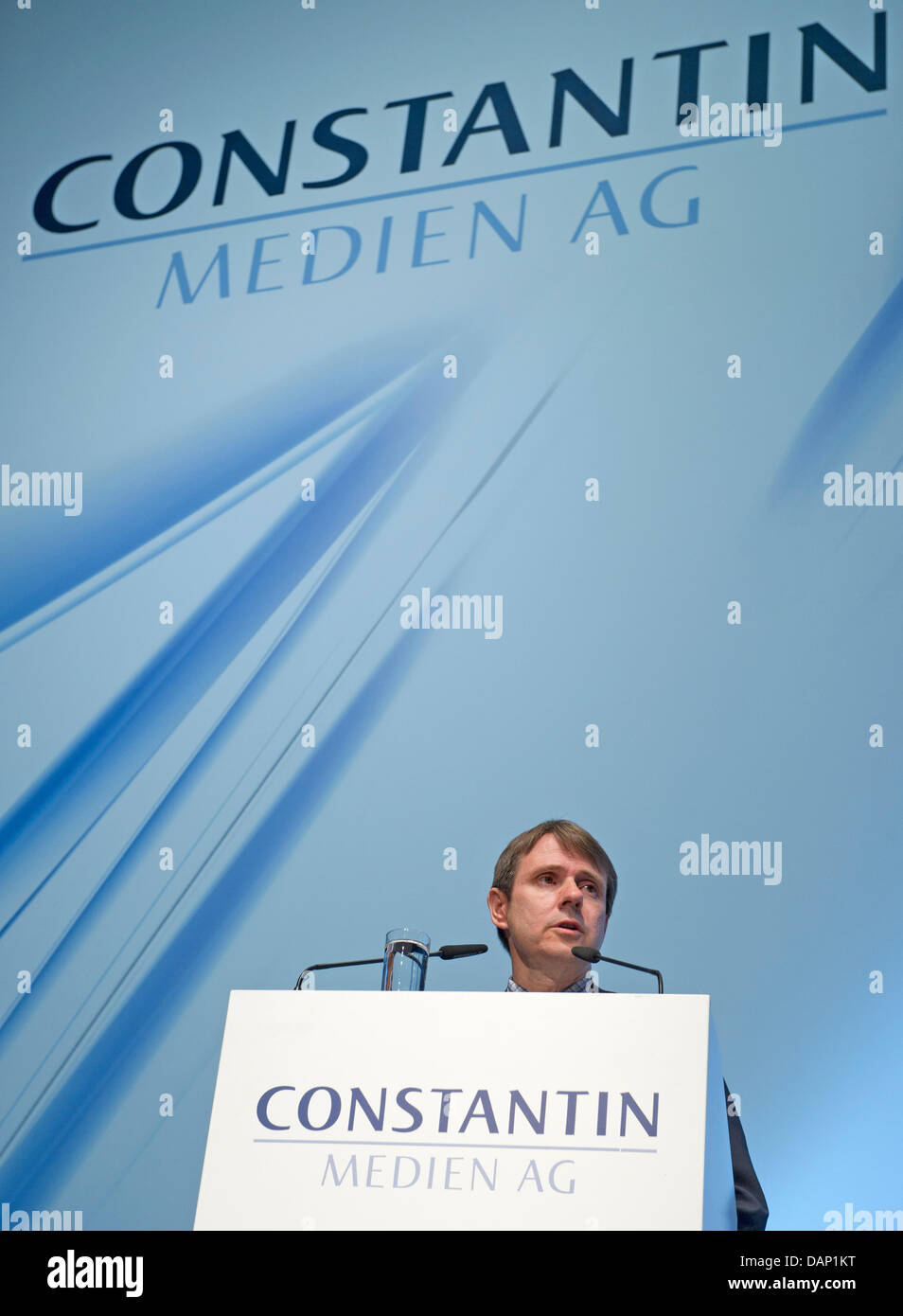 Head of the German production company Constantin, Bernhard Burgener, talks to shareholders during the annual general meeting of the Constantin Media AG in Munich, Germany, 19 July 2011. Photo: PETER KNEFFEL Stock Photo