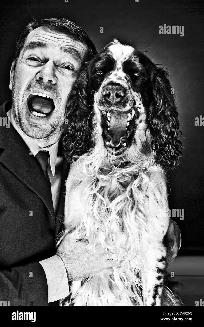 Portrait of mature man and English Springer Spaniel shouting Stock Photo