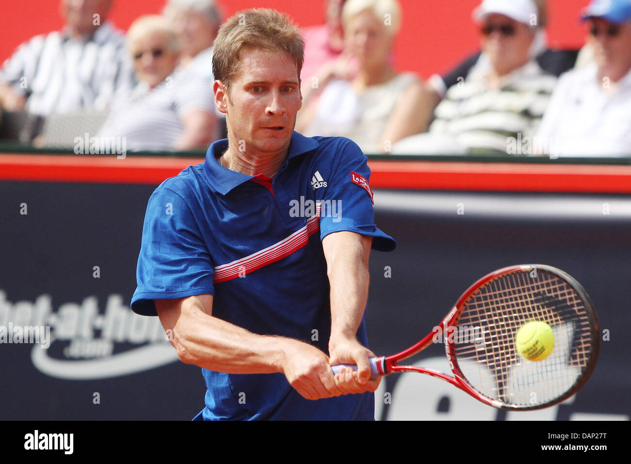 German tennis professional Florian Mayer plays a backhand during the ATP  match against Turkey's Marsel Ilhan at Rothenbaum in Hamburg, Germany, 20  July 2011. Turnaments of the ATP World Tour at Rothenbaum