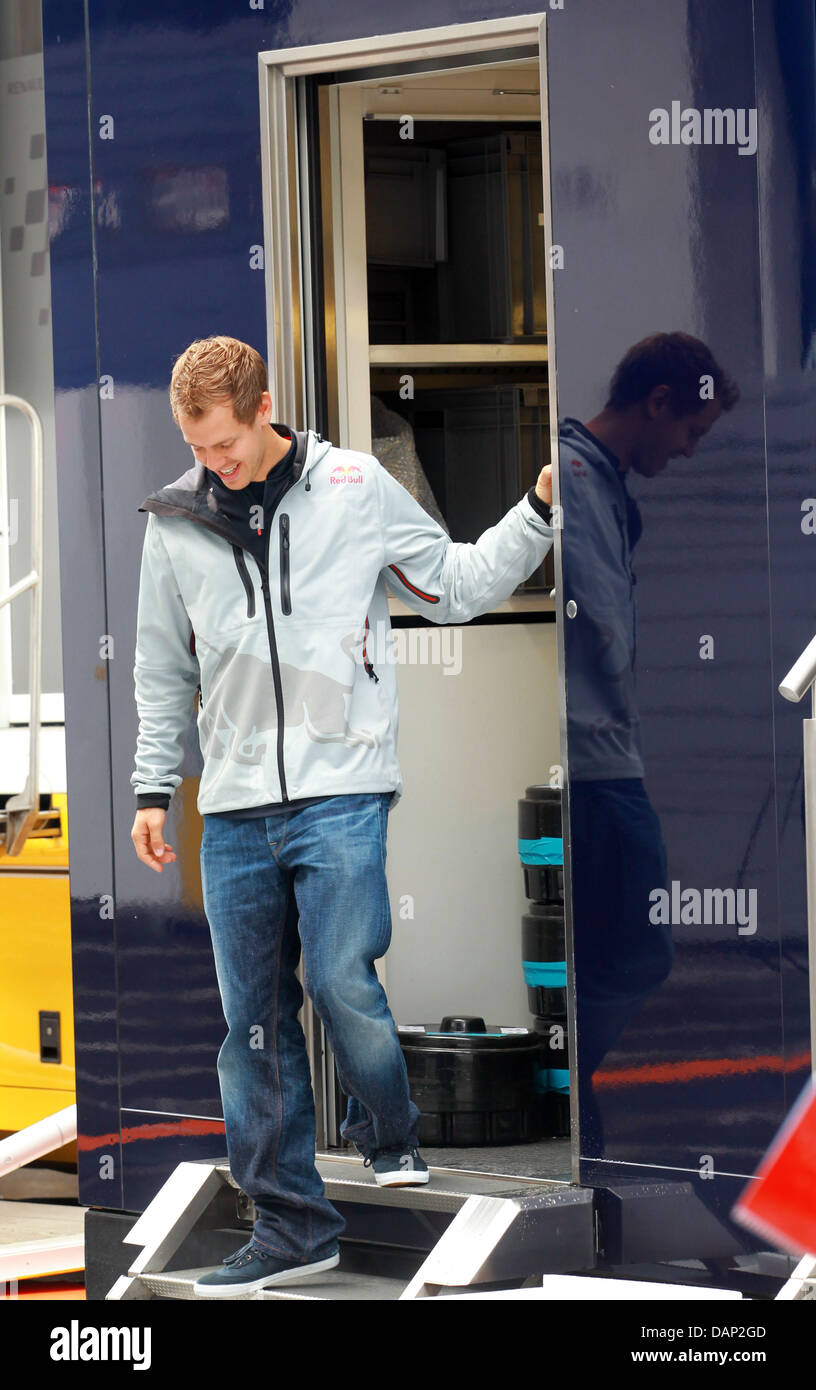 German Formula One driver Sebastian Vettel of Red Bull walks through the paddock of the F1 race track of Nuerburgring, Nuerburg, 21 July 2011. The Formular One Grand Prix of Germany will take place on 24 July. Photo: Roland Weihrauch dpa/lrs  +++(c) dpa - Bildfunk+++ Stock Photo