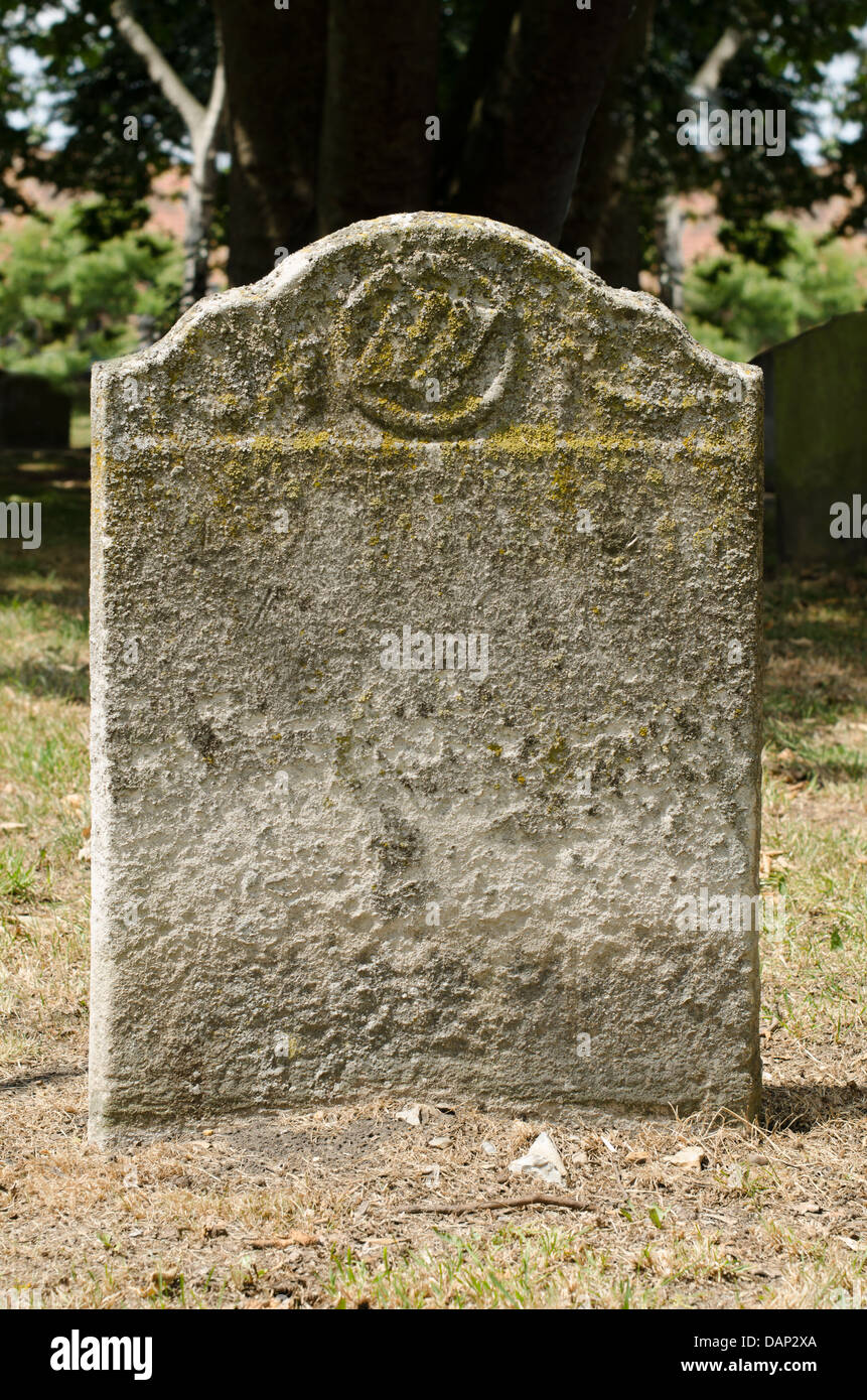 Old weathered gravestone in an ancient cemetery