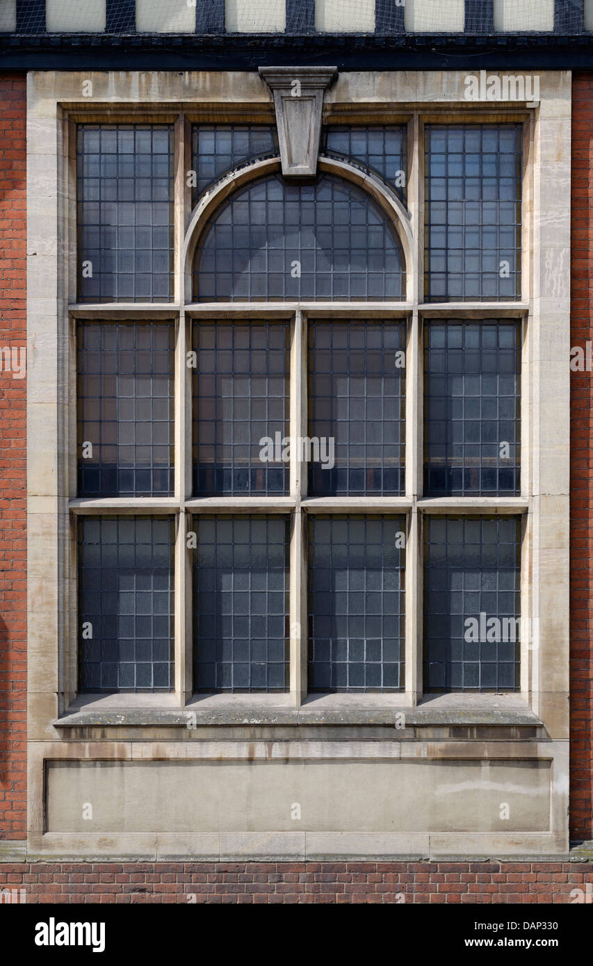 Old historic leaded window with carved stone frame Stock Photo