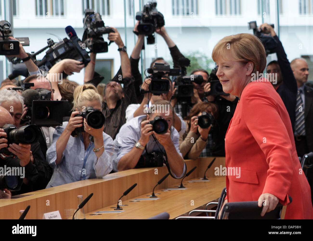 German Chancellor Angela Merkel arrives at the annual summer press ...