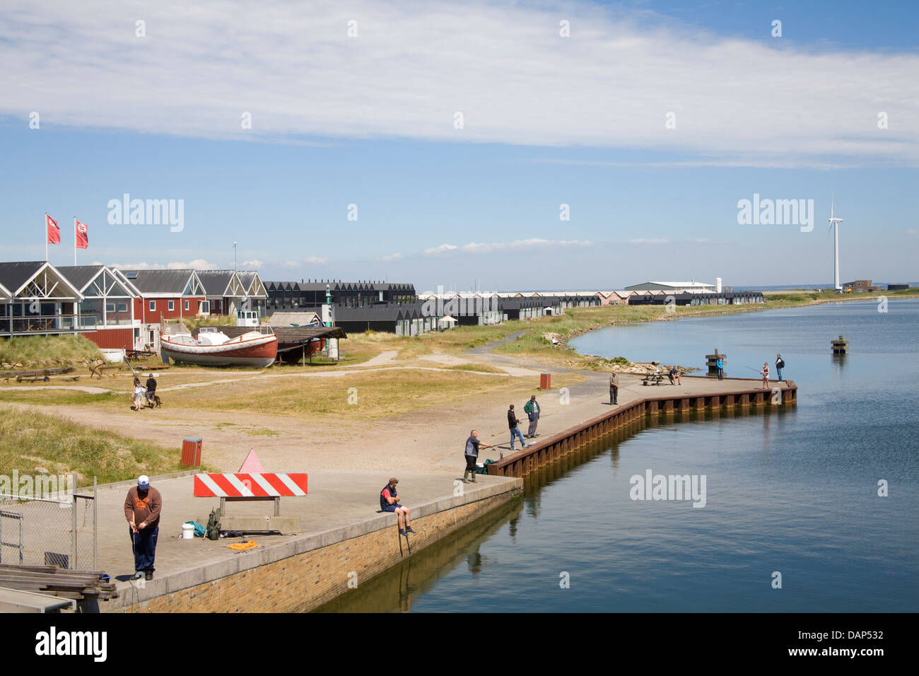 Hvide Sande West Jutland Denmark EU Men and woman fishing in canal off  Ringkobing Fjord Stock Photo - Alamy