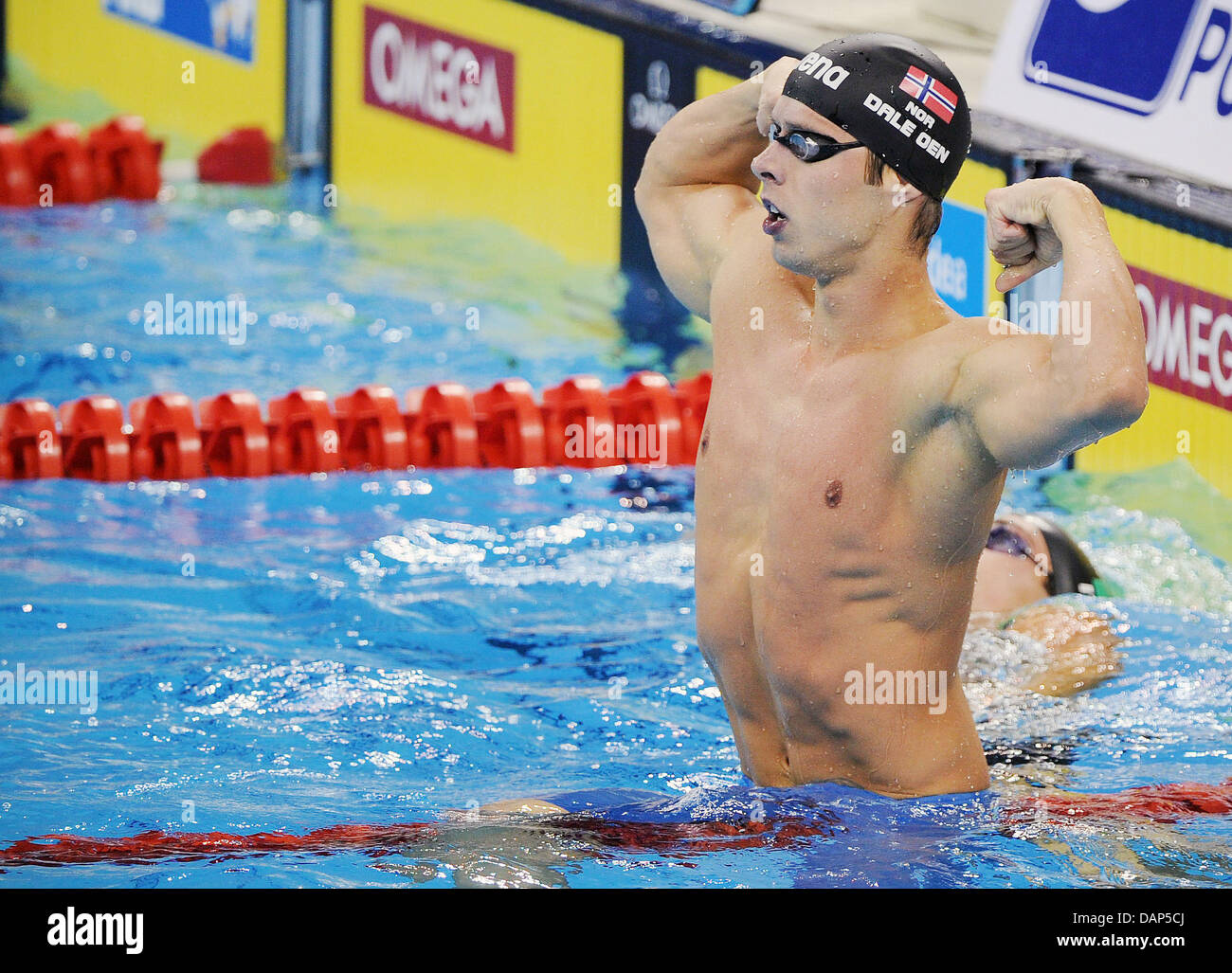 Swimmer Alexander Dale Oen Of Norway Reacts After Winning Mens 100m Breathstroke Final At The