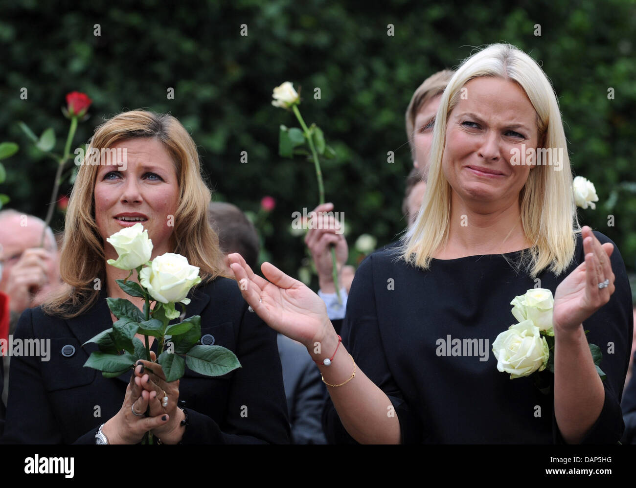 Crownprincess Mette-Marit (r) and princess Märtha Louise taking part of the rose walk in Oslo, Norway, 25 July 2011. The Norwegian man charged in last week's attacks in Norway, which claimed at least 76 lives, was Monday remanded in custody for eight weeks by Oslo district court. A. B. Breivik was charged with the bombing in Oslo's government district on Friday and a shooting at a  Stock Photo