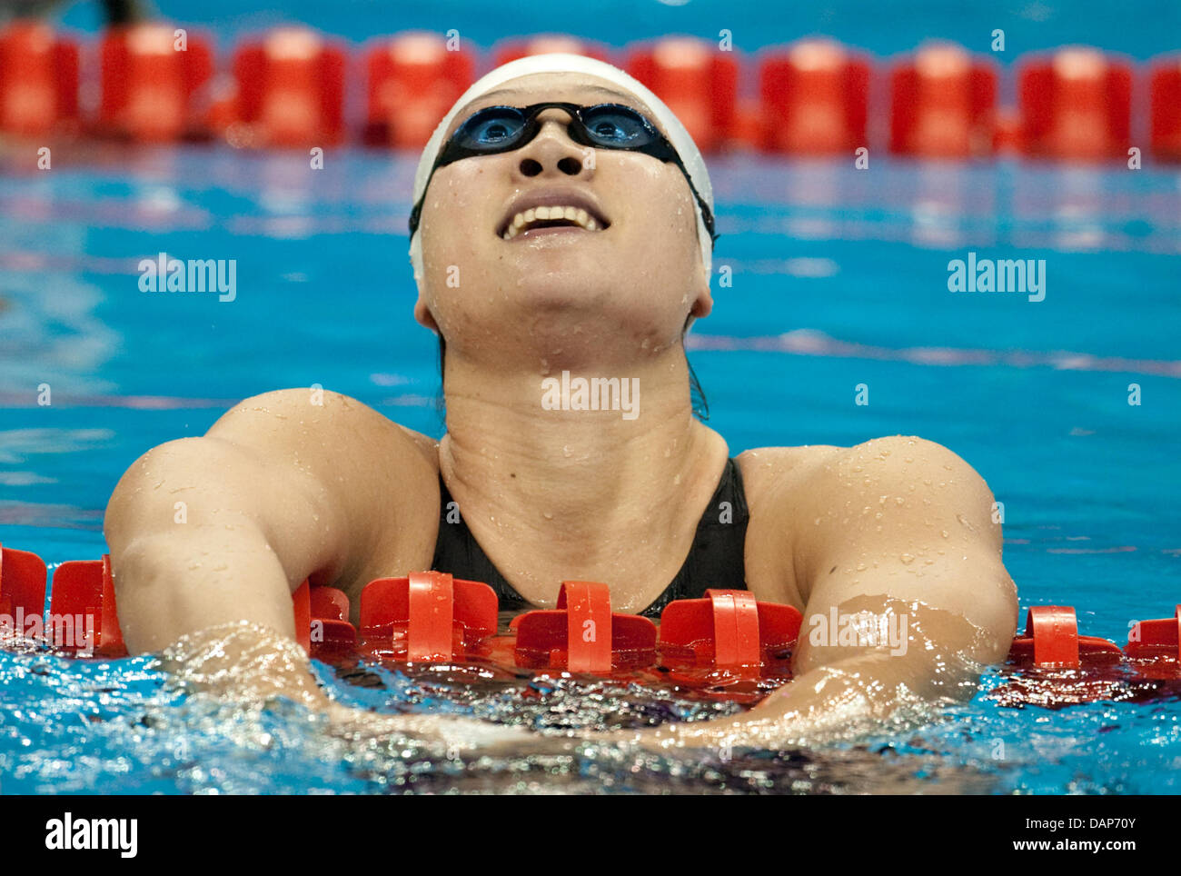 Zige Liu of China celebrates her third place the women's 200m Butterfly ...