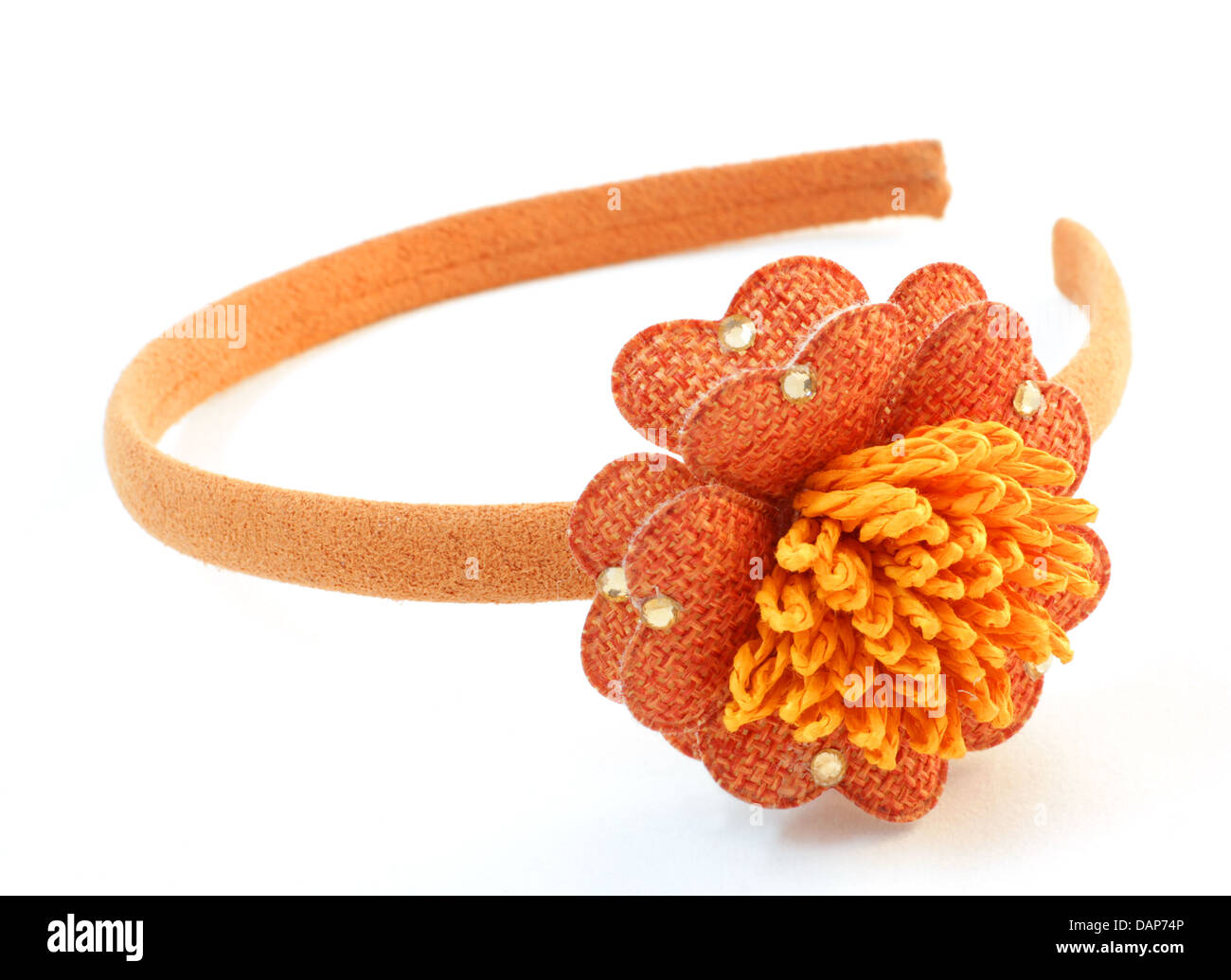 Orange hair band with an orange flower handmade on white background Stock Photo