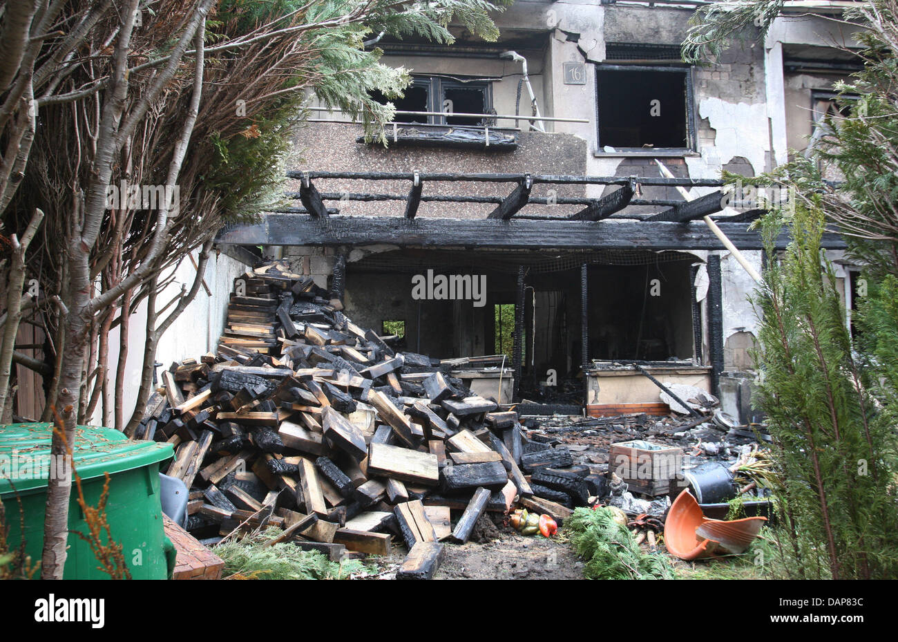 A burnt down row house is pictured in Winterhausen, Germany, 01 August 2011. According to the police, the fire were probably caused by an explosion and broke out during the night. Two dead bodies were found in the house. Photo: KARL-JOSEF HILDENBRAND Stock Photo