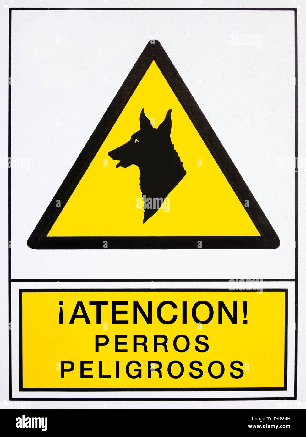 Attention! dangerous dogs signal in spanish language Stock Photo Alamy