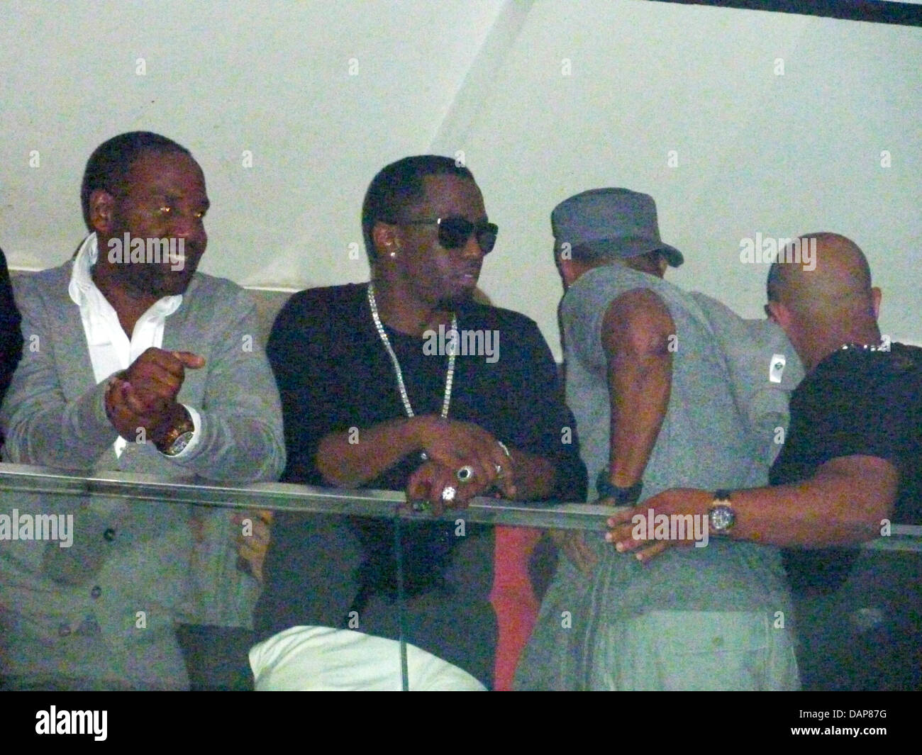 The American rapper P. Diddy (2 from L) stands with friends in the