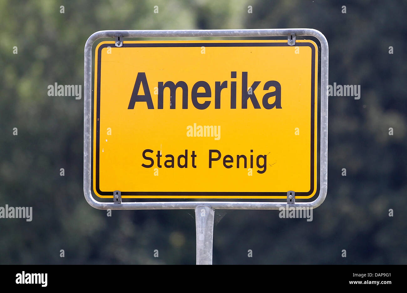 The name place sign of the town 'Amerika' is pictured on 02 August 2011 in Germany. The small town belongs to the city Penig in Germany. Accordning to a legend, the town was named Amerika, because formerly one could only reach it when crossing the Mulde river. So one had to go 'across the pond' to get to Amerika. Photo: Jan Woitas Stock Photo