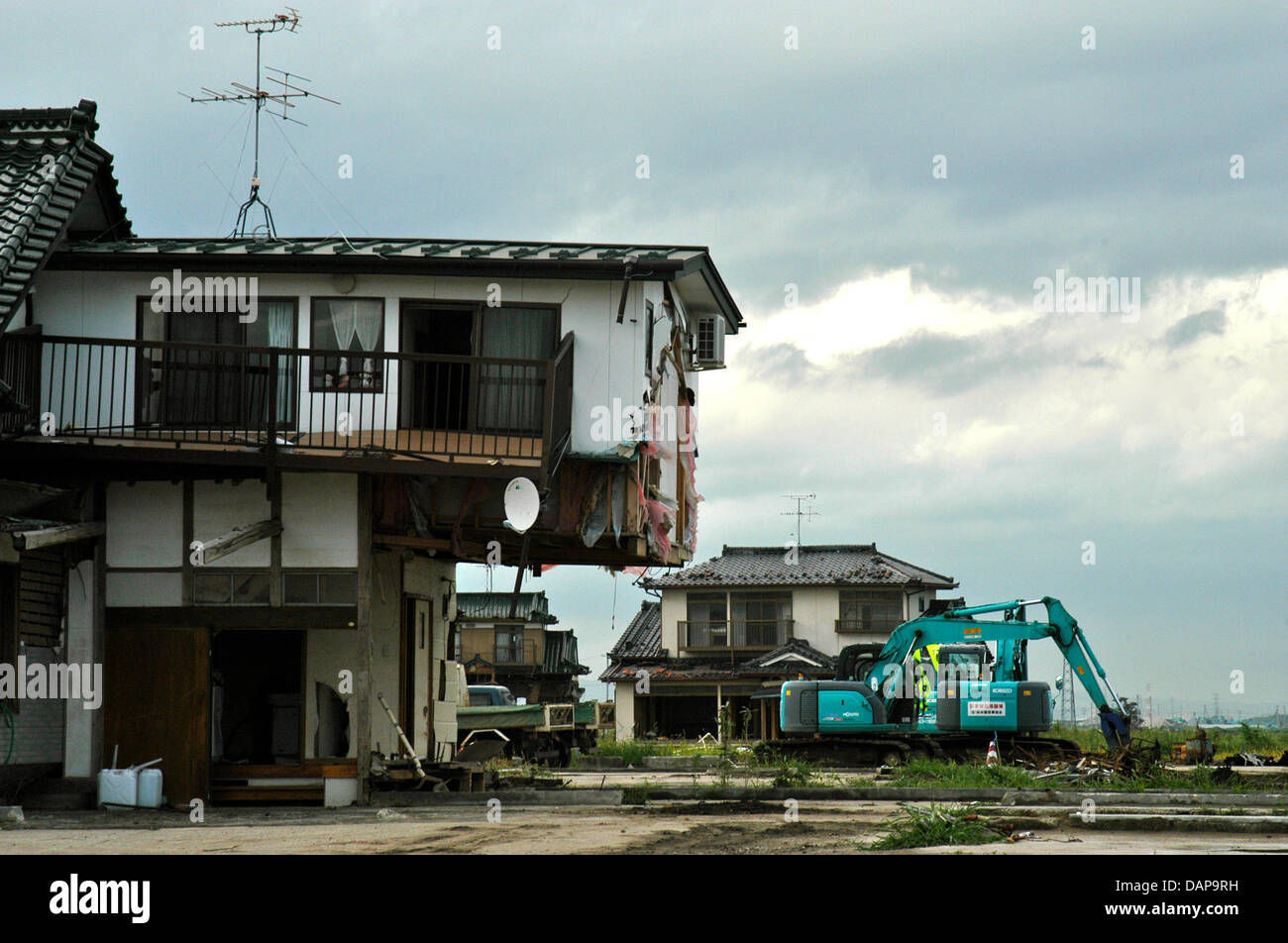 Debris lies about the street, five months after the tsunami hit the town of Sendai, Japan, 2 August 2011. The destruction that was caused by the earthquake can still be seen, but reconstruction is on a good way. Photo: Lars Nikolaysen Stock Photo