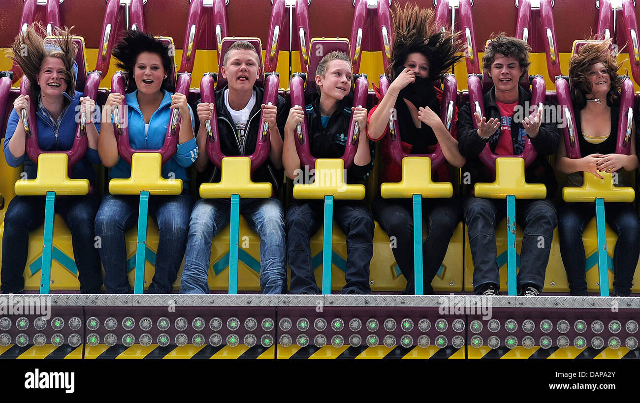 Visitors ride a carousel at the Cranger Kirmes fair in Herne, Germany, 05 August 2011. Around four million visitors are expected by the organizers until 14 August 2011, therefore, the folks festival is one of the best attended in Germany. Photo: MARIUS BECKER Stock Photo