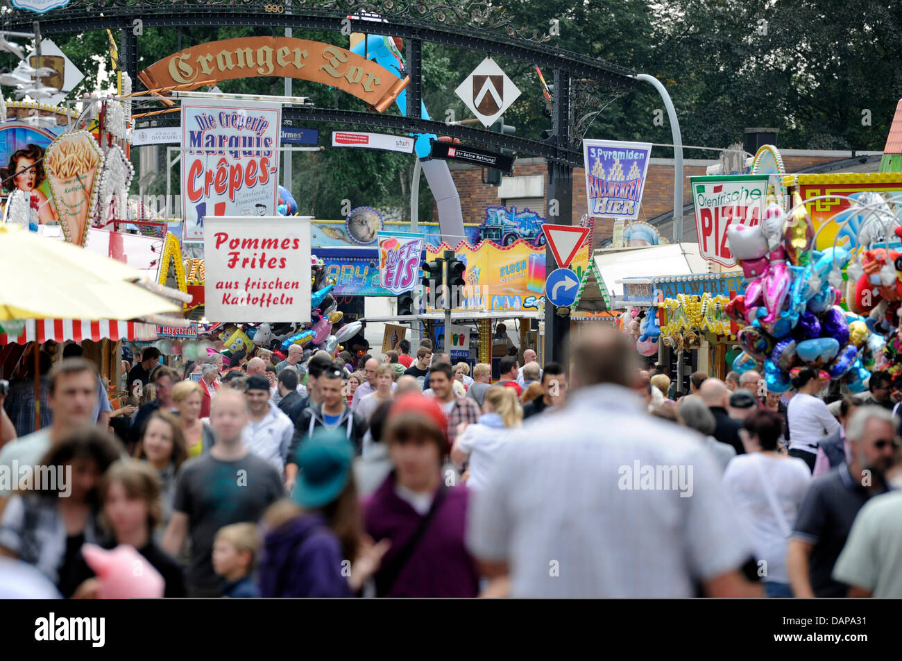 Visitors stroll through the Cranger Kirmes fair in Herne, Germany, 05 August 2011. Around four million visitors are expected by the organizers until 14 August 2011, therefore, the folks festival is one of the best attended in Germany. Photo: MARIUS BECKER Stock Photo