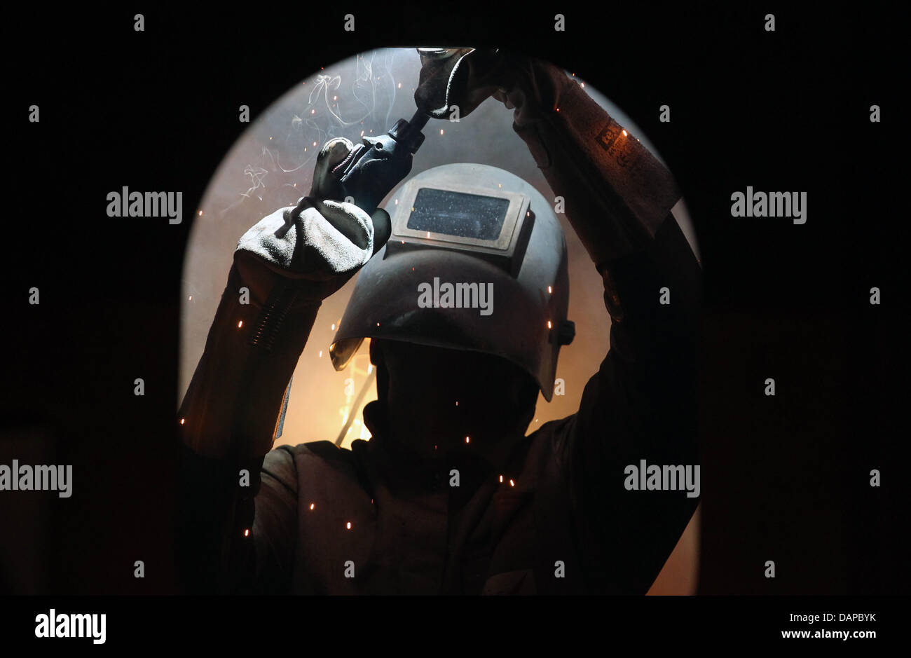 A welder works in a section for the offshore plattform 'BorWin' at the