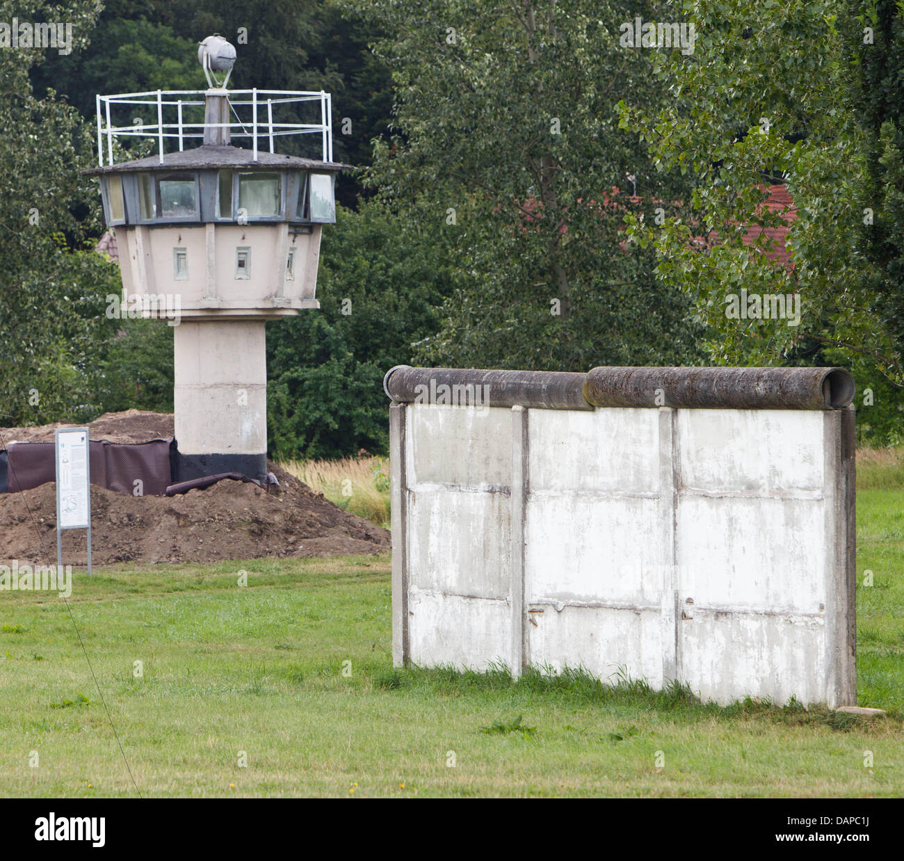 A watchtower and pieces of the Wall are visible at the memorial site Hoetensleben, situated at the former inner-German border, in Hoetensleben, Germany, 10 August 2011. The remains at the state border between Saxony-Anhalt and Lower Saxony are preserved along an area of 6.5 hectars and 350m in length. In spring 1952 the GDR government erected a five kilometre wide restricted area a Stock Photo