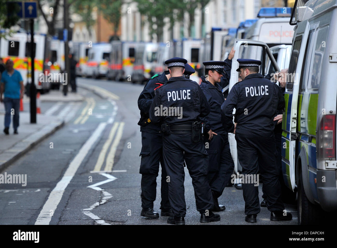 Police officers prepare for the upcoming night in Westminster, London ...