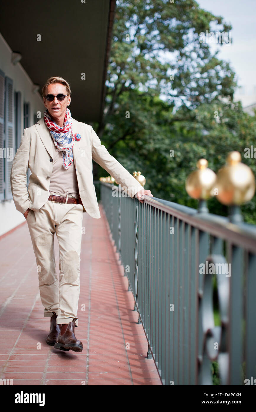 Fashion designer Wolfgang Joop poses in front of the headquarters of  Galeria Kaufhof in Cologne, Germany, 11 August 2011. Joop presented his  collection 1879, which he designed for Galeria Kaufhof. The collection