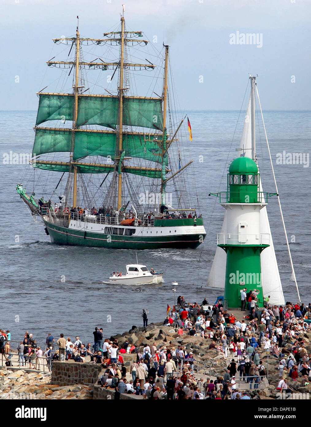 Sailing ships go to sea during a cruising race initiated as part of the 21st Hanse Sail in Warnemuende at the Baltic Sea, Germany, 13 August 2011. About 250 traditional and historic ships from the whole worls have gathered for the maritime spectacle in Germany. Photo: Bernd Wuestneck Stock Photo