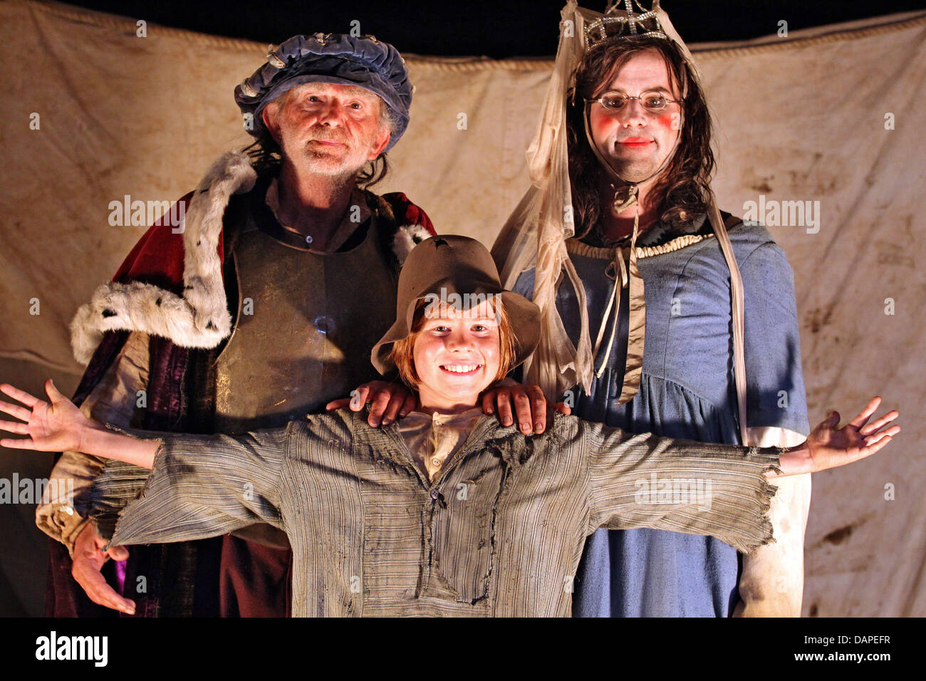 Actors Michael Gwisdek (L), Kurt Kroemer and Leon Seidel (C) pose during the filming of the