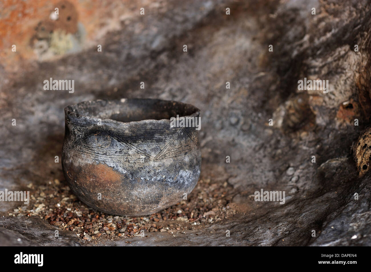 An old clay pot in a cave in the Niassa National Park, Mozambique Stock Photo