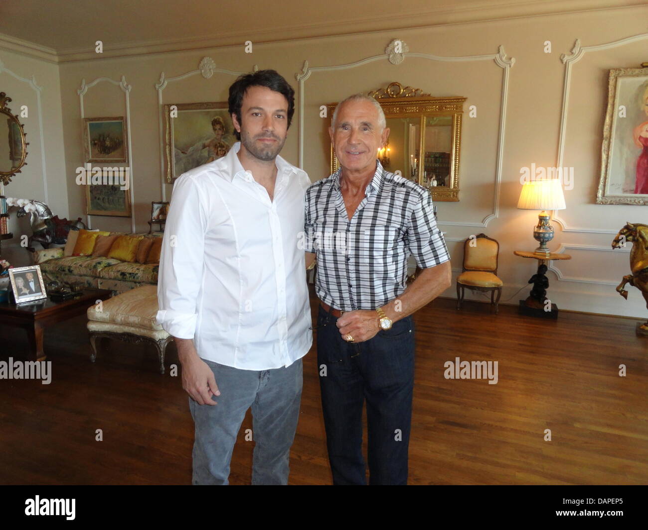 HANDOUT - A handout picture dated July 2011 shows US-actor Ben Affleck (L) and Frederic Prince of Anhalt at the Chimney room of the Prince's villa in Bel Air, Los Angeles, USA. The 68-year-old Prince lets his Hollywood house to Ben Affleck (39) for at least ten days, who will shoot his new film 'Argo' there. According to Prince of Anhalt, who shall take part in this movie, the hous Stock Photo