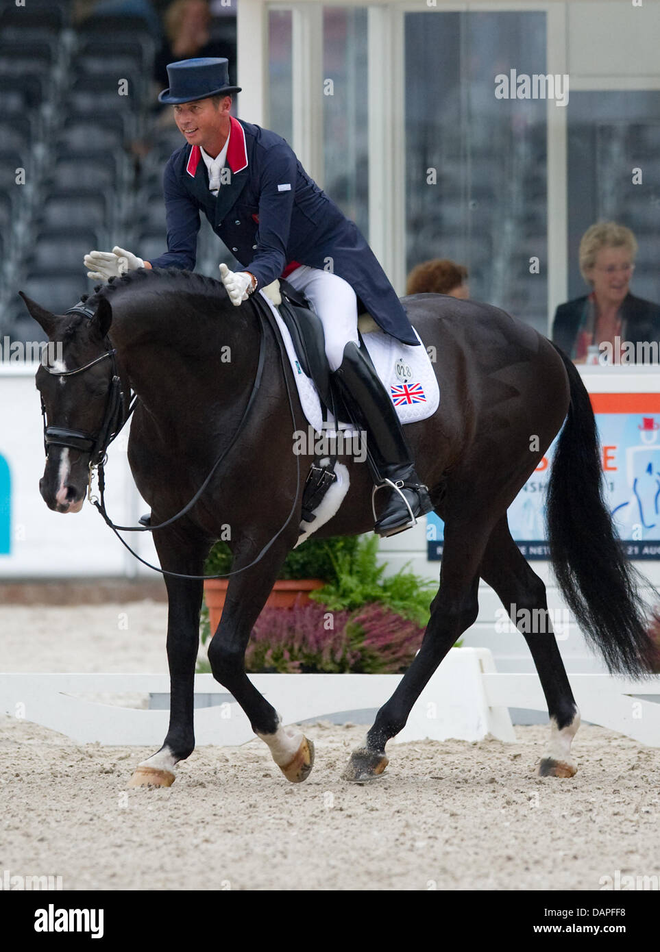 British dressage rider Carl Hester thanks his horseUthopia after the