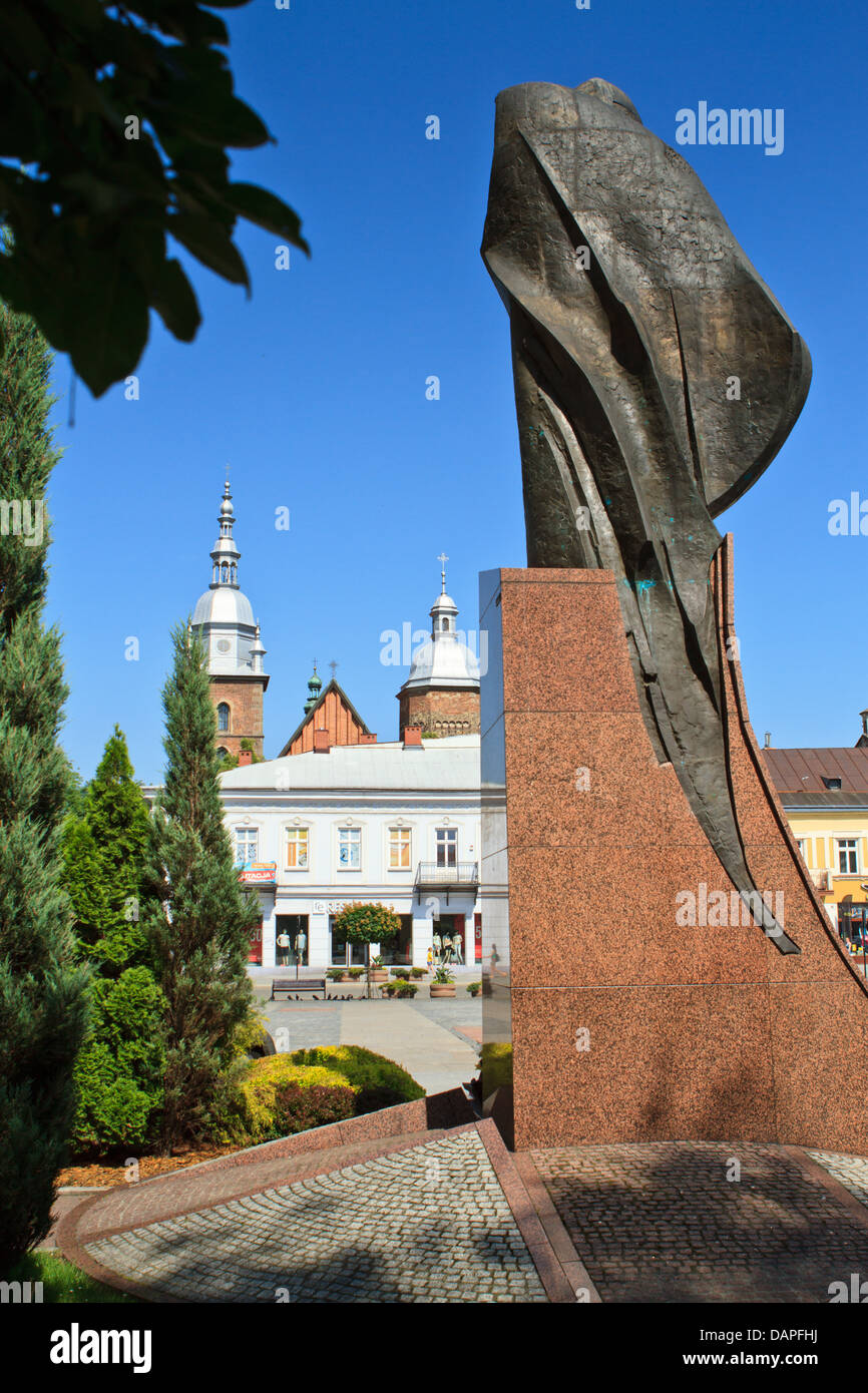 Statue of John Paul II and towers of St Margaret basilica. Central
