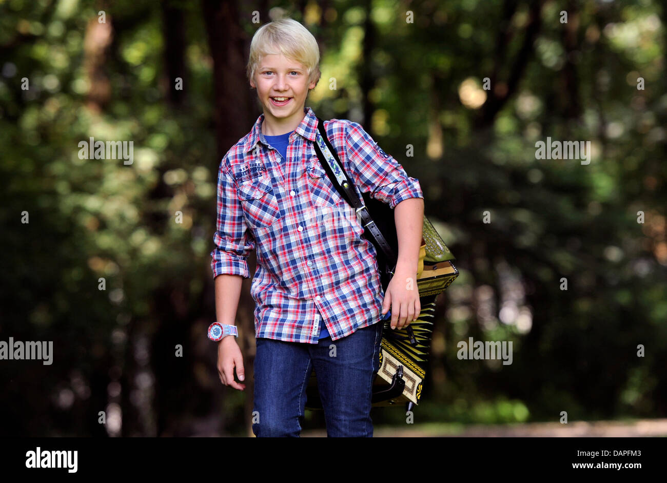Twelve-year-old musician Quirin Weber poses in Munich, Germany, 17 August 2011. Weber could be the new star in German folk music. On 19 August 2011, Weber's first Album 'Musik, fertig, los!' ('Music, ready, go!') will be in stores. Photo: Tobias Hase Stock Photo