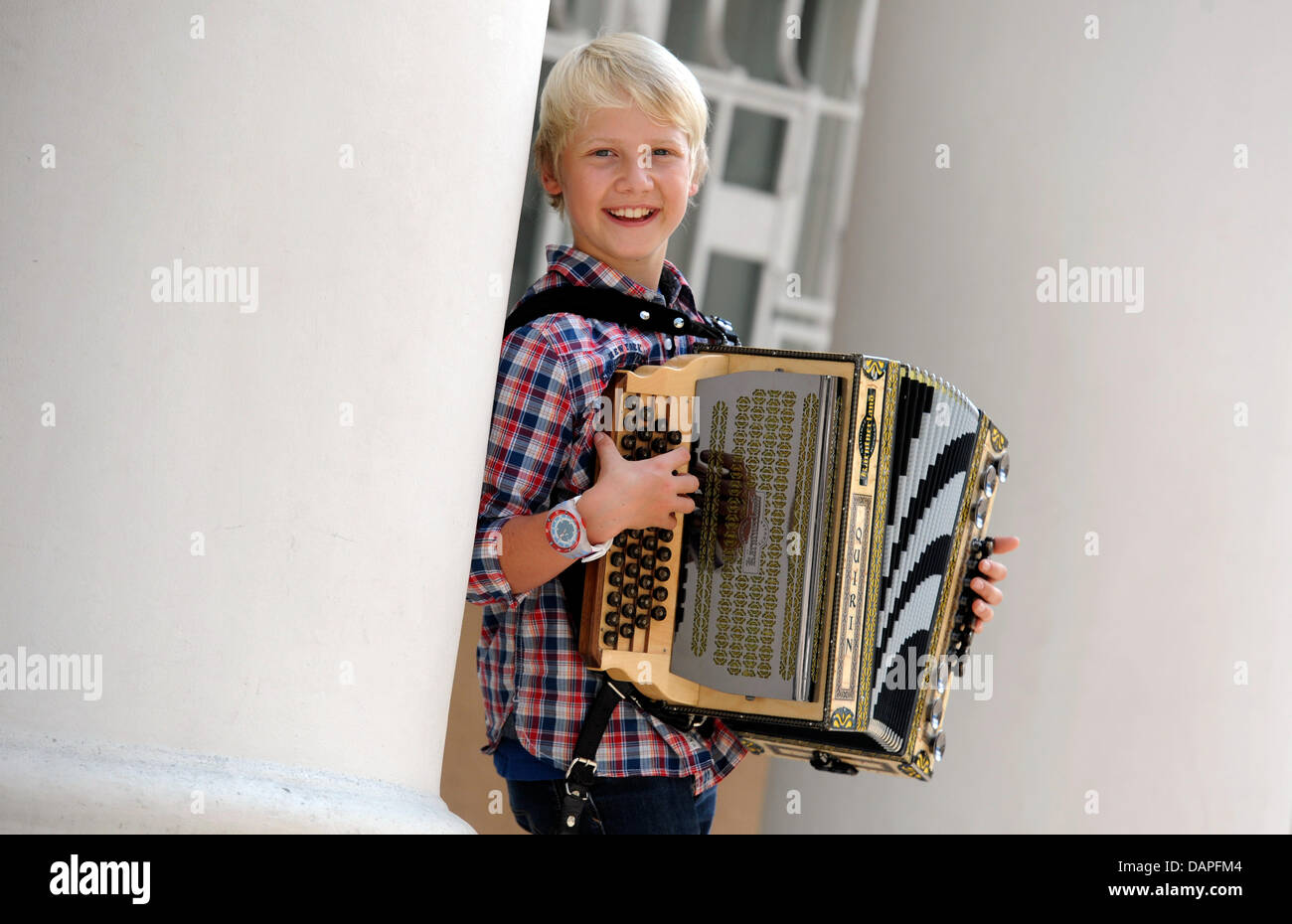 Twelve-year-old musician Quirin Weber poses in Munich, Germany, 17 August 2011. Weber could be the new star in German folk music. On 19 August 2011, Weber's first Album 'Musik, fertig, los!' ('Music, ready, go!') will be in stores. Photo: Tobias Hase Stock Photo