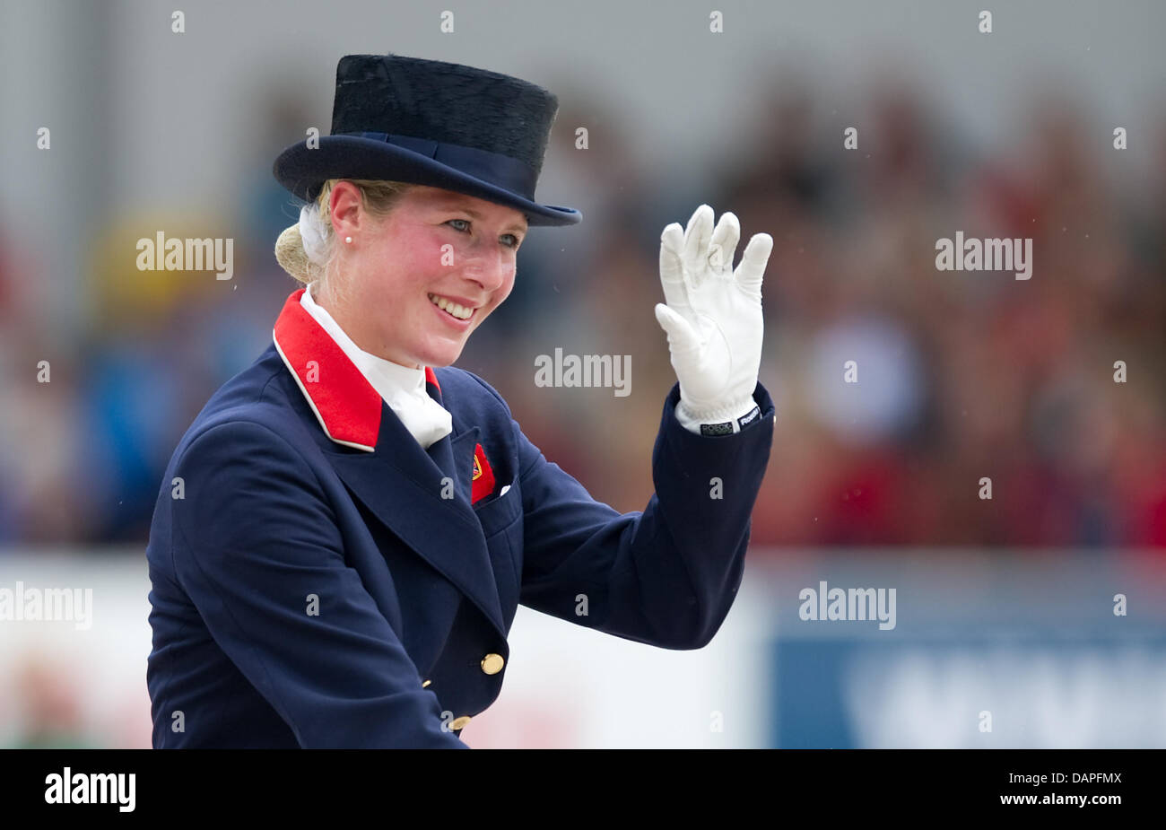 British dressage rider Laura Bechtolsheimer waves during the team