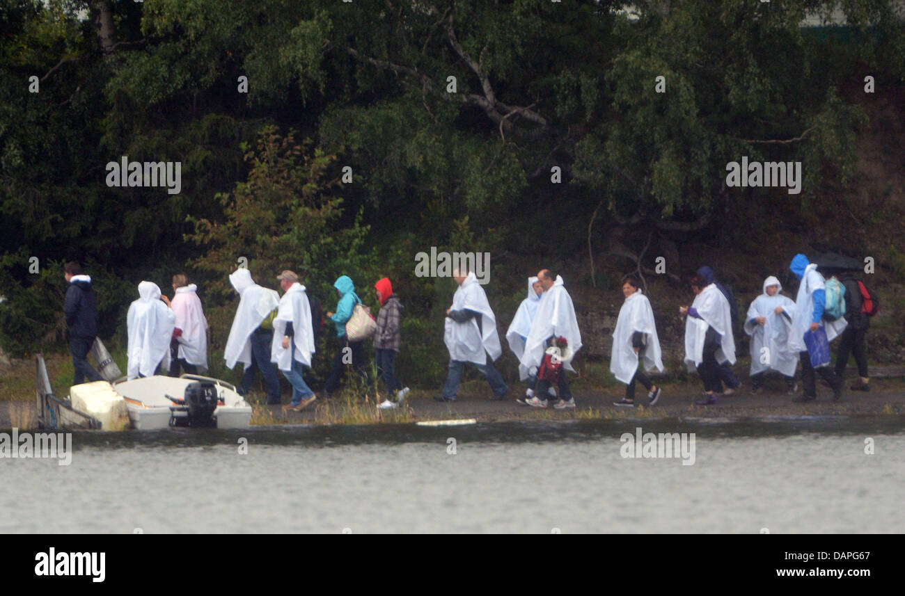 Relatives of the victims that died in the shooting stand on the island