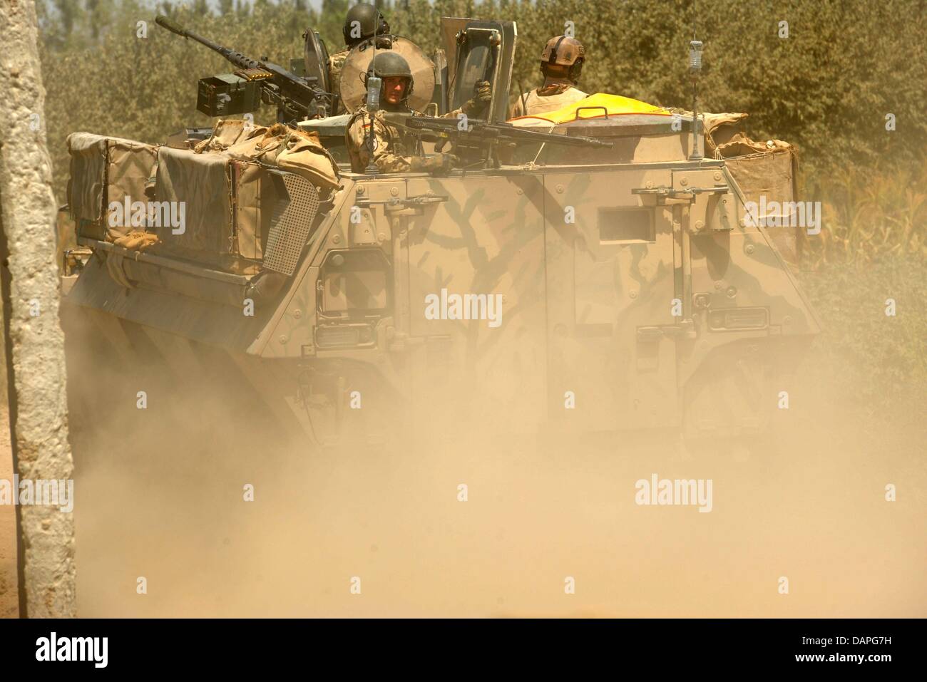 Soldiers of the German Bundeswehr patrol in tanks during a supply ...