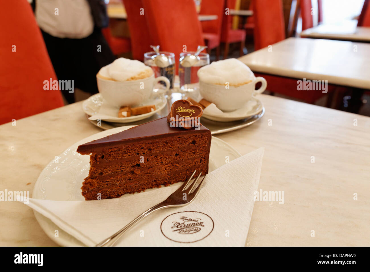 Austria, Upper Austria, Plate of cake with coffee on table Stock Photo