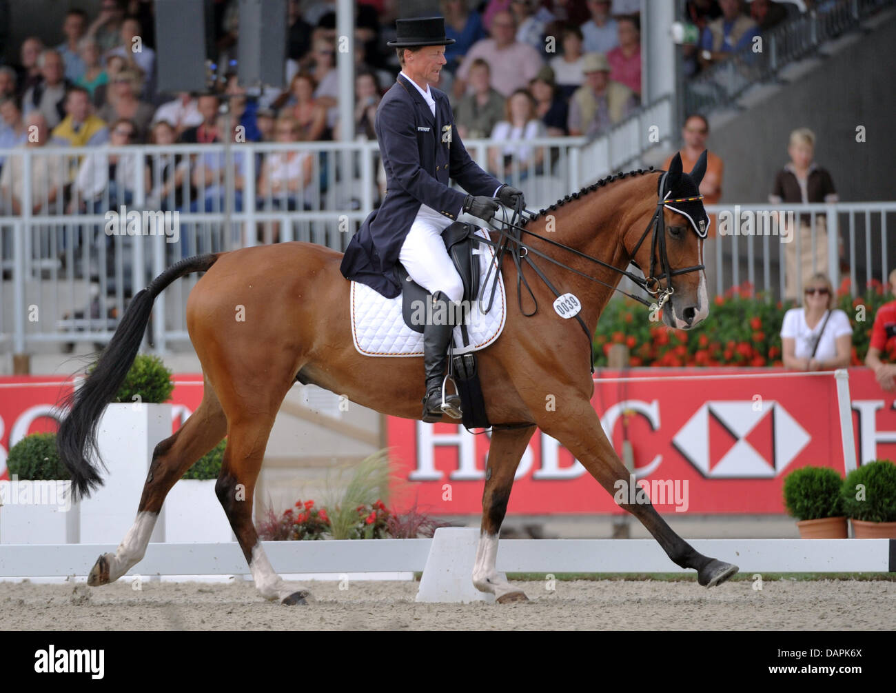 The German eventing equestrian Peter Thomsen passes a lettering of