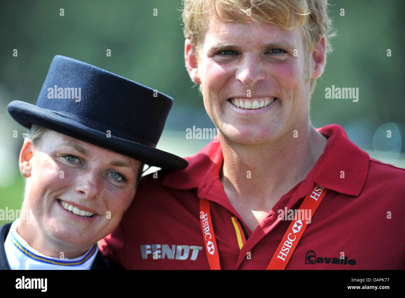 The German eventing equestrian Frank Osthold and his wife Sara Algotsson-Osthold, starting for Sweden, pose after their dressage tournament of the European Eventing Championship in Luhmuehlen, Germany, 25 August 2011. 70 Equestrians from 14 nations will compete in the dressage, cross-country and show jumping until 28 August 2011. Photo: JOCHEN LUEBKE Stock Photo