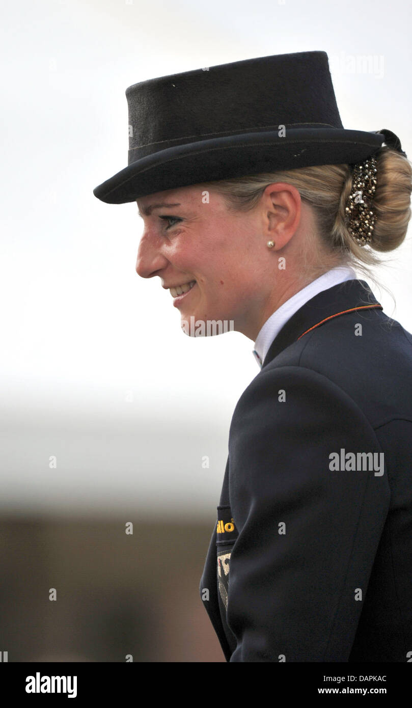 German eventing rider Julia Mestern smiles during the dressage event of the European Eventing Championships in Luhmuehlen, Germany, 25 August 2011. Until 28 August 2011, 70 riders from 14 nationes compete in the events dressage, cross-country and show jumping. Photo: Jochen Luebke Stock Photo