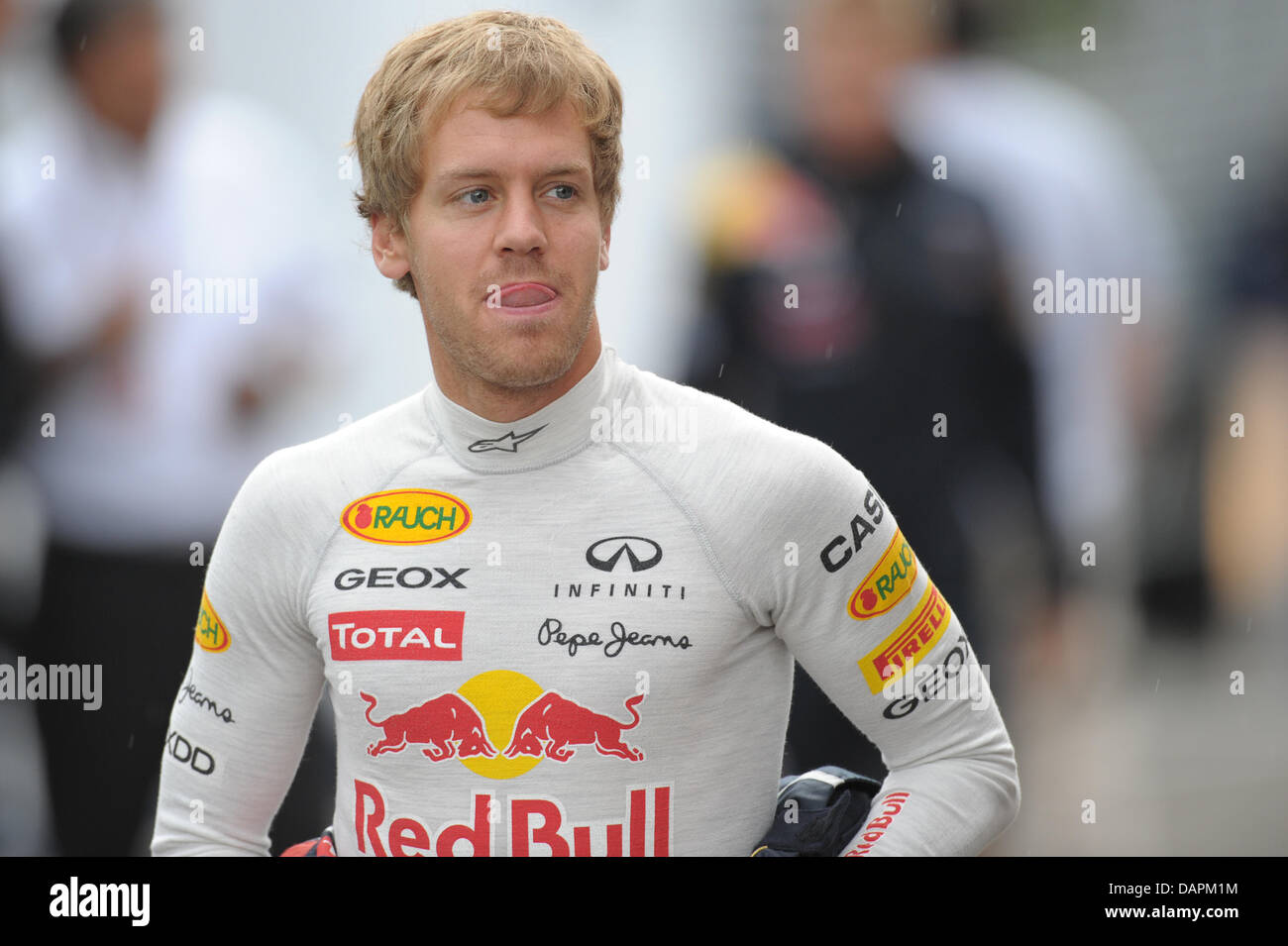 German Formula One driver Sebastian Vettel of Red Bull runs trough the paddock at the Circuit de Spa-Francorchamps near Spa, Belgium, 26 August 2011. The Formula One Grand Prix of Belgium will take place on 28 August 2011. Photo: David Ebener dpa  +++(c) dpa - Bildfunk+++ Stock Photo