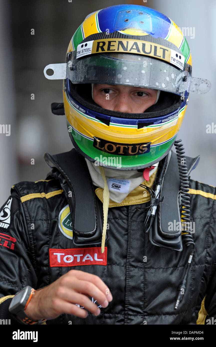 Brazilian Formula One driver Bruno Senna of Lotus Renault walks through