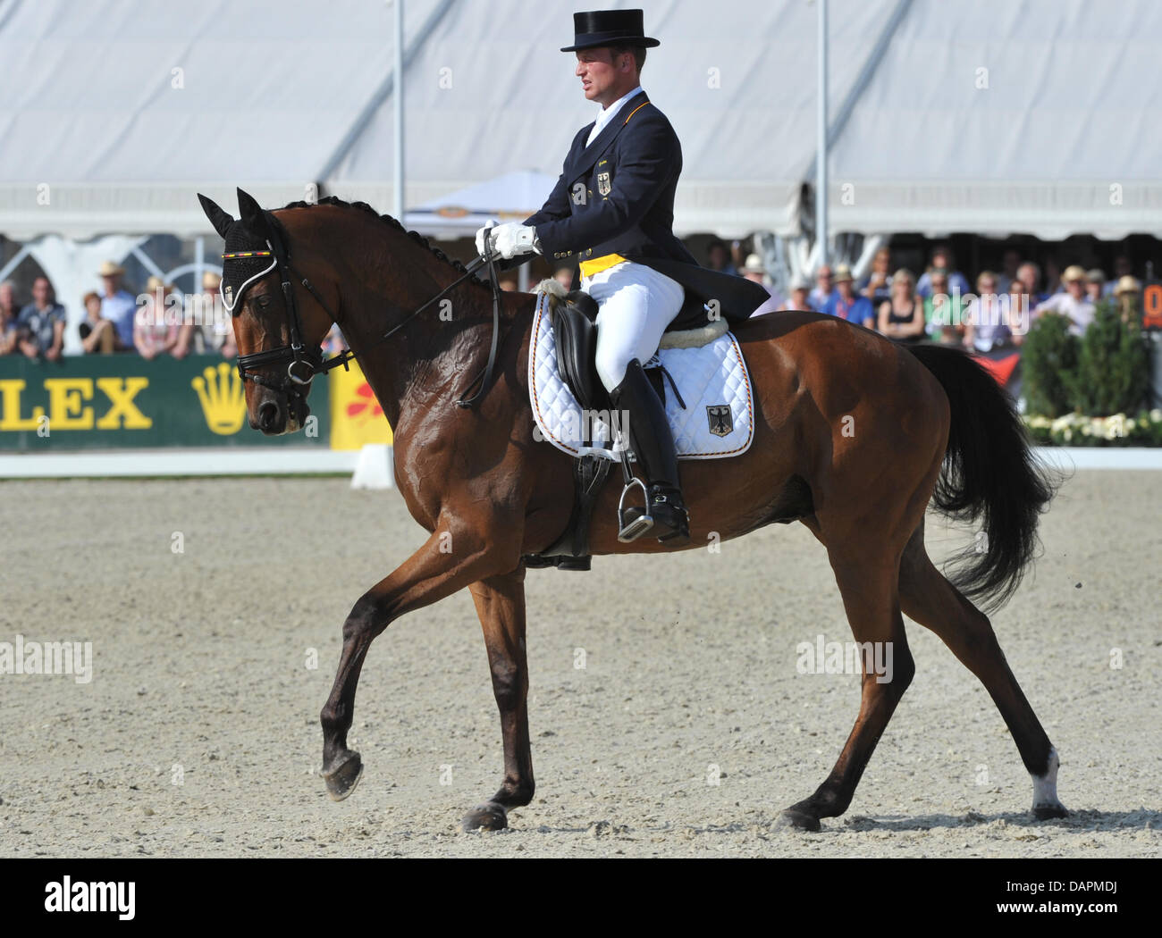 The German eventing equestrian Michael Jung rides his horse Sam during