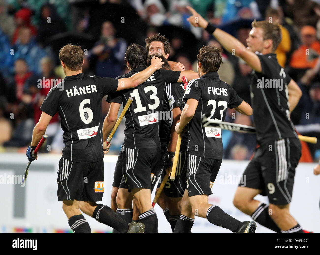German national hockey player Philipp Zeller (CHIDDEN) celebrates his goal with the team during
