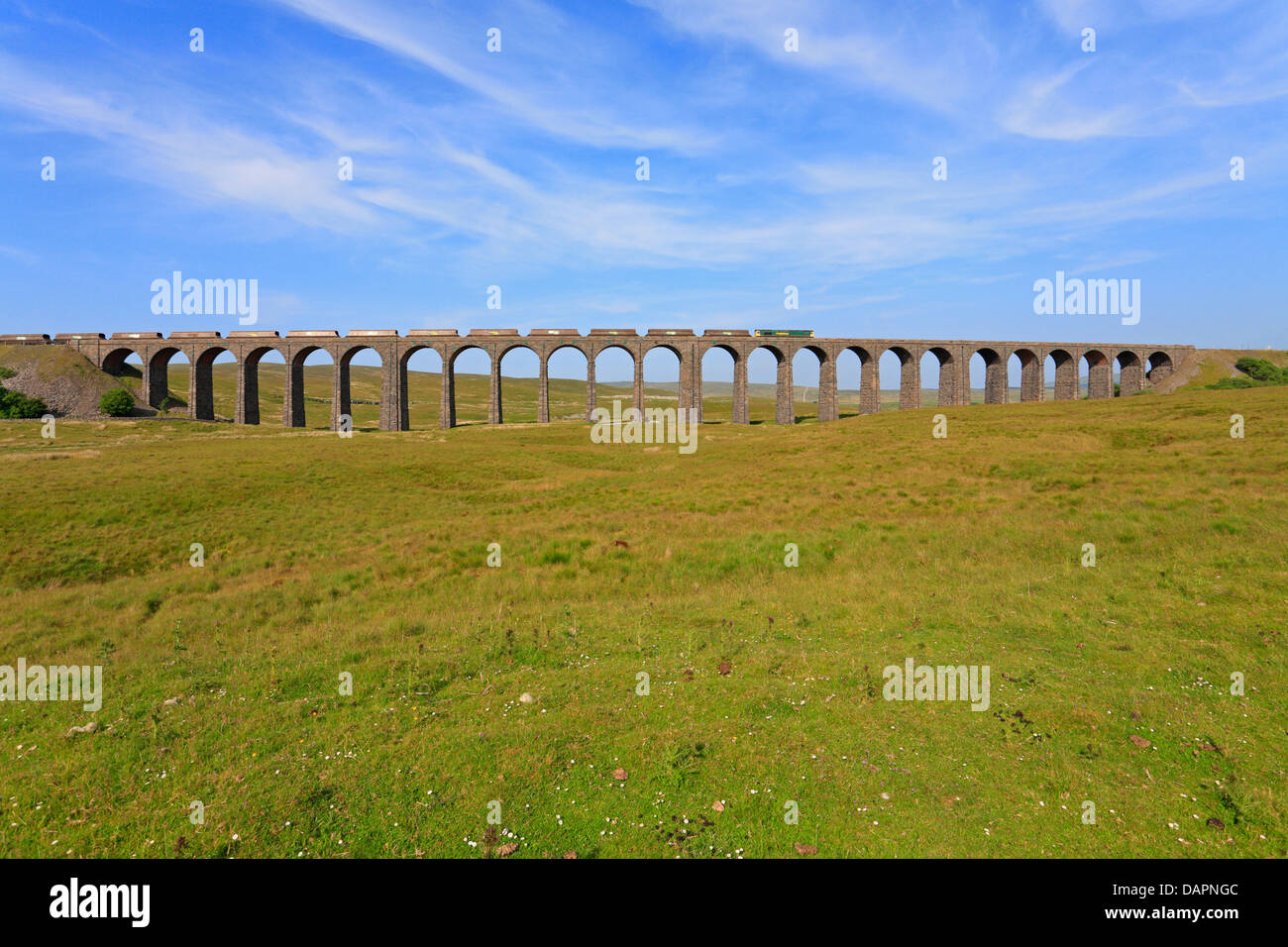 Freight train crossing the Ribblehead Viaduct, North Yorkshire, Yorkshire Dales National Park, England, UK. Stock Photo