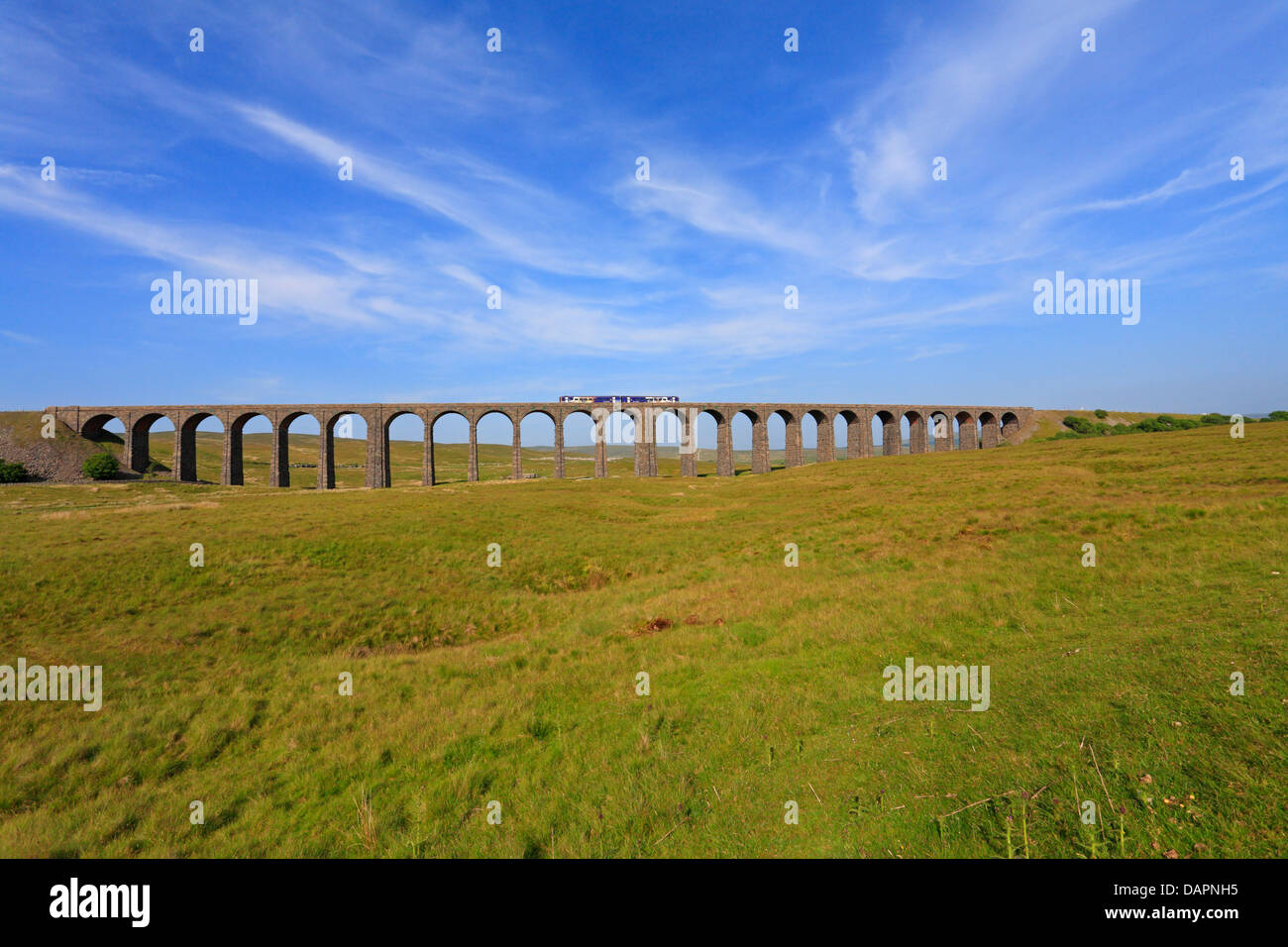 Passenger train crossing the Ribblehead Viaduct, North Yorkshire, Yorkshire Dales National Park, England, UK. Stock Photo
