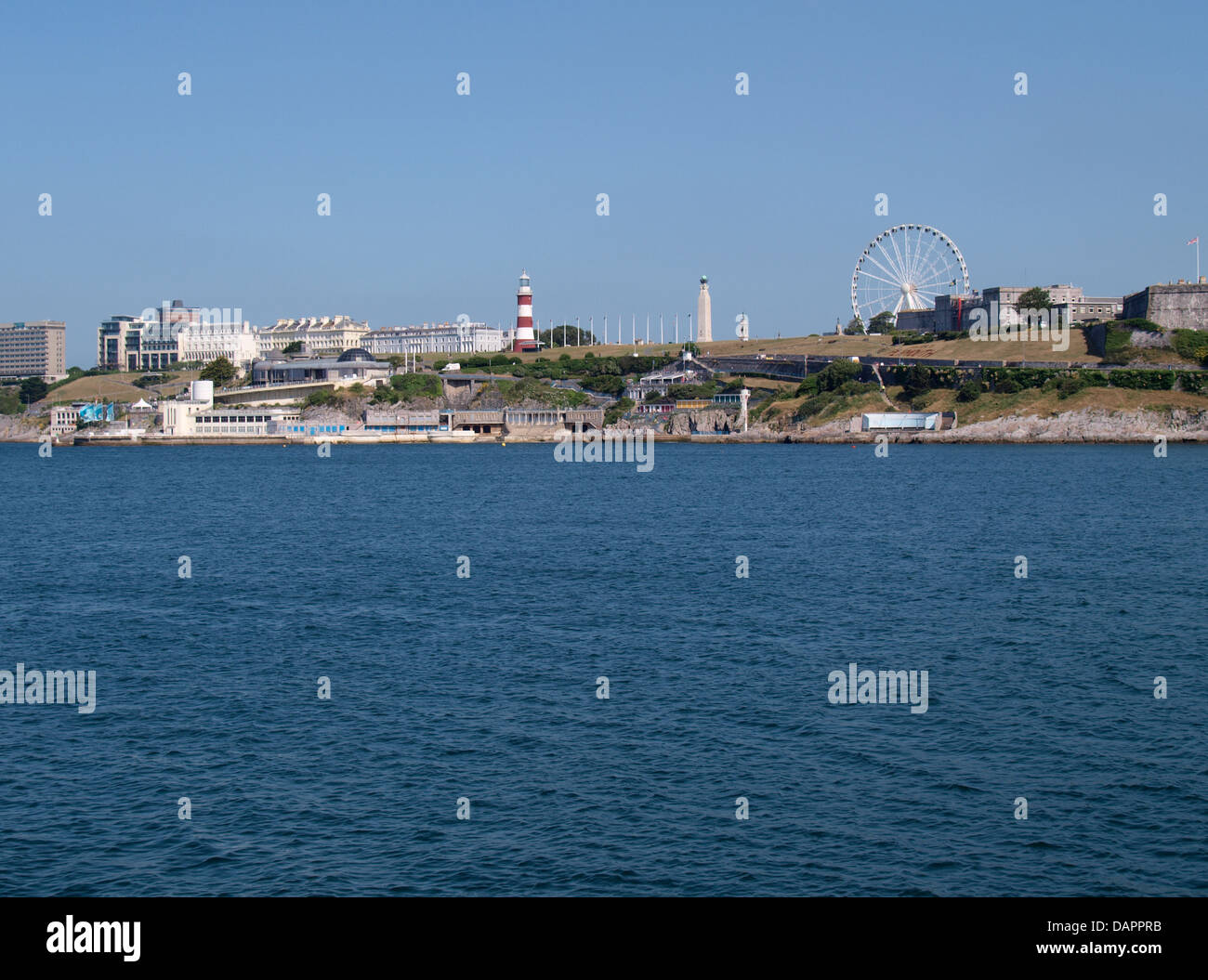 Plymouth Hoe area with Smeaton's Tower lighthouse and the Plymouth Eye big wheel seen from the Mount Batten Breakwater, UK 2013 Stock Photo