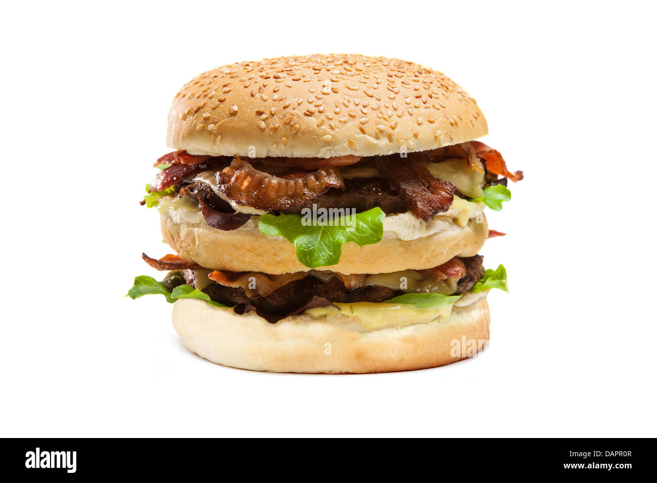 Juicy double hamburger with cheese and bacon isolated on white background Stock Photo