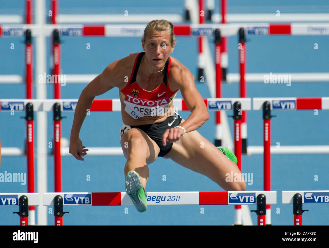 Jennifer Oeser of Germany competes in the womens 100 m Hurdels event of the Heptathlon competition at the 13th IAAF World Championships in Athletics, in Daegu, Republic of Korea, 29 August 2011. Photo: Bernd Thissen dpa Stock Photo